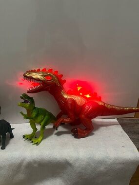Bundle / lot of 13 Dinosaurs including Light-Up Red and Gold Dinosaur